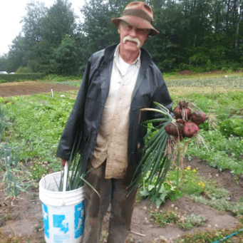 Glen Flett, project manager, with a fresh harvest from Emma’s Acres